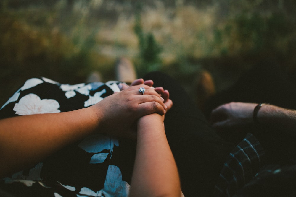 man and woman holding each others hand