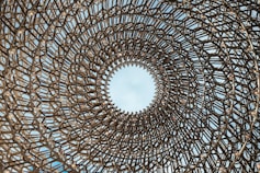 low-angle of brown metal structure during daytime