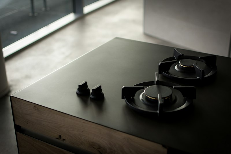 Modern black cooktop set into a benchtop