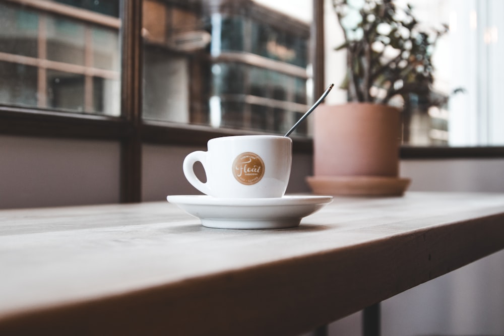 cup with saucer on table