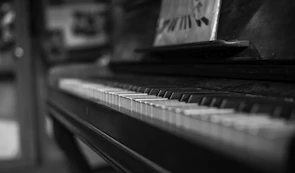 Close-up of piano keys showing the craftsmanship of a vintage upright piano.