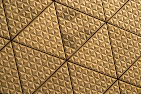a close up of a ceiling with a pattern on it