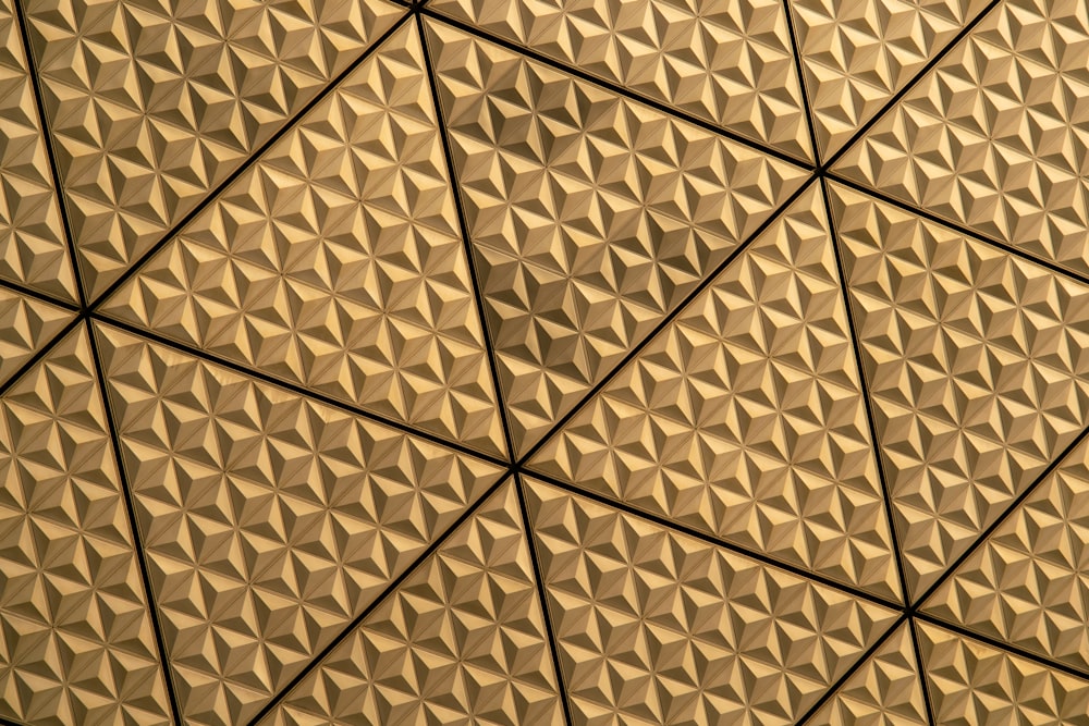 a close up of a ceiling with a pattern on it