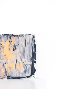 gray and yellow abstract painting