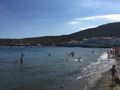 Smiling travelers enjoying a sunny day at Barcelona's beach