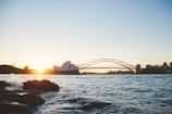 Wide shot of Sydney Harbour Bridge at sunset, symbolizing new journeys and opportunities.