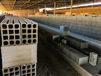Close-up image of precast concrete wall panels being installed at a factory site.