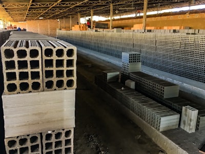 Close-up image of precast concrete wall panels being installed at a factory site.