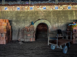 Modern brick kiln emitting soft orange glow during the firing process at dusk