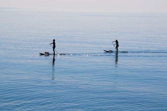 photo of West Bay Stand up paddle surfing near Portland Bill Lighthouse