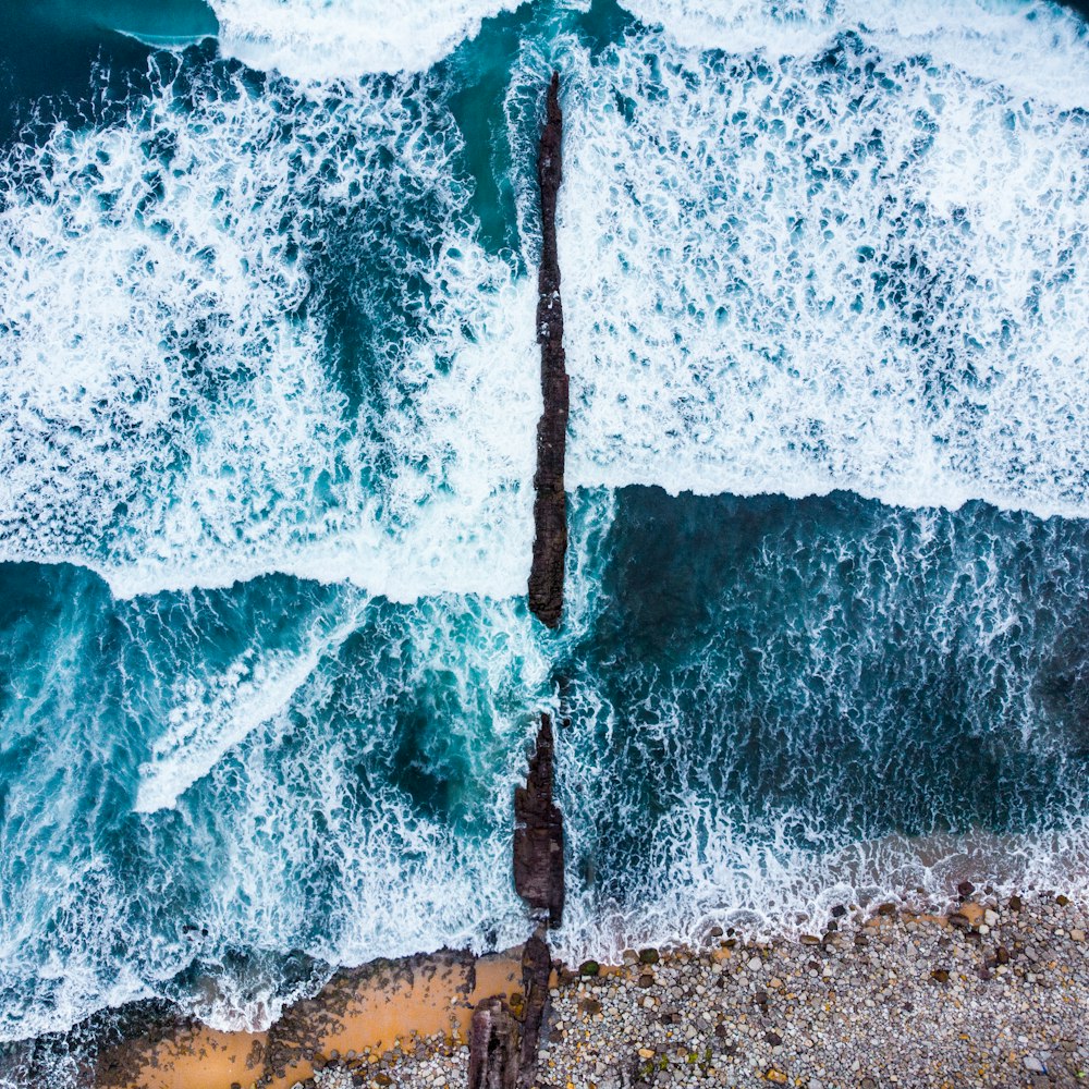 body of water and rock formations