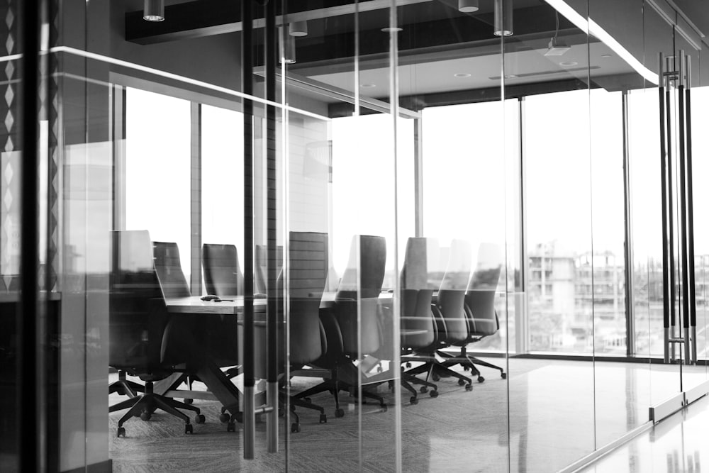 grayscale photography of corporate room