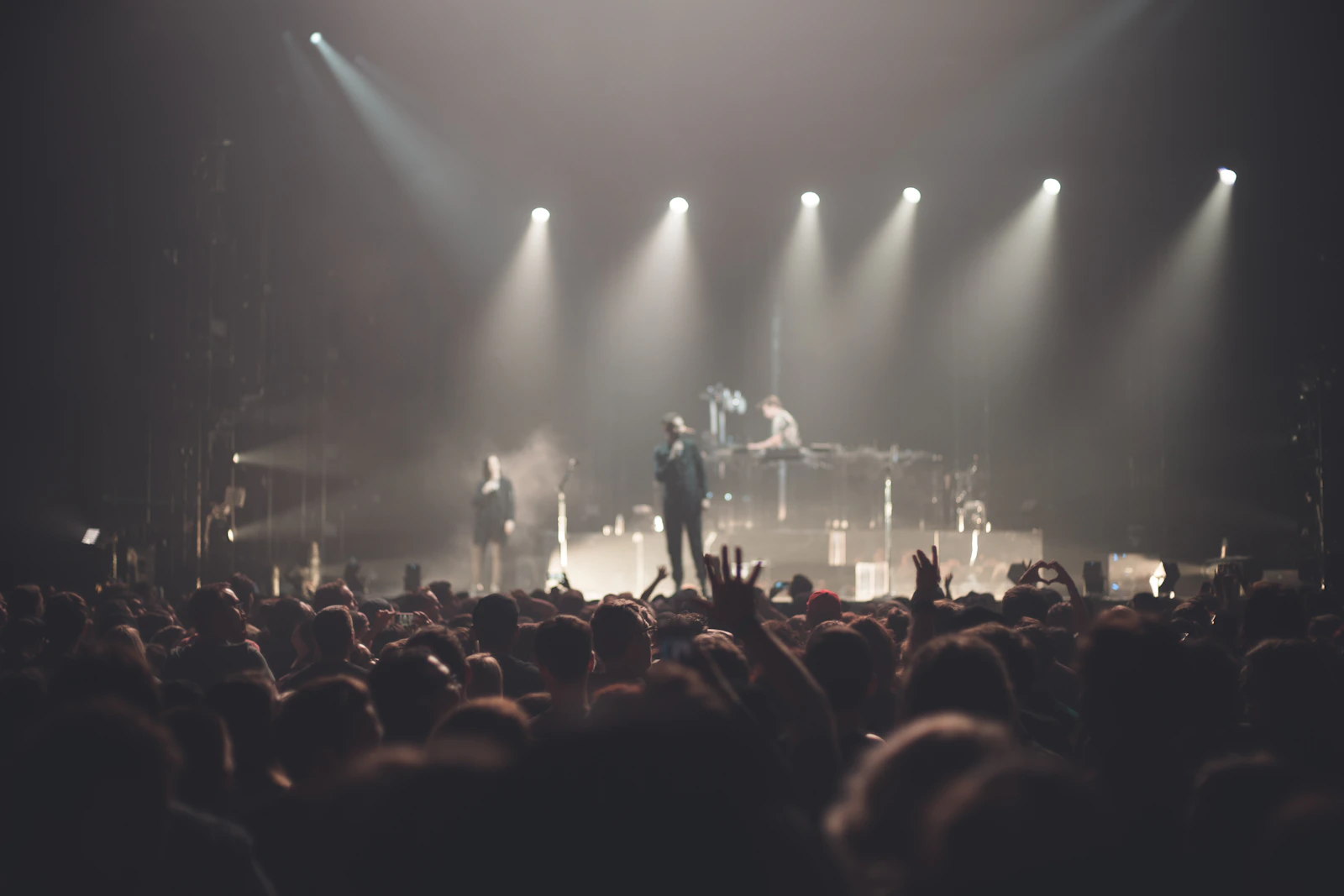 Band performing live on stage in front of a crowd