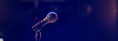 black and gray microphone on black stand