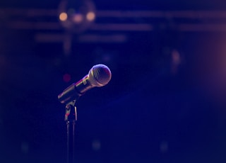 black and gray microphone on black stand