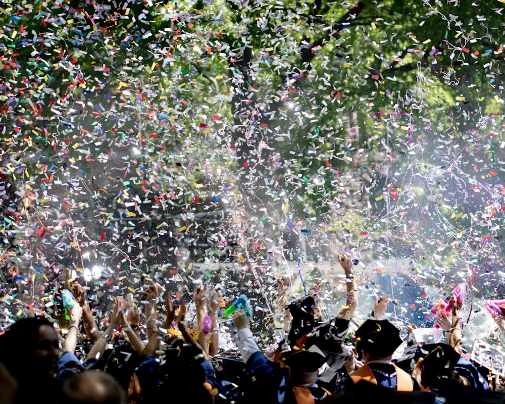 people covered by confetti