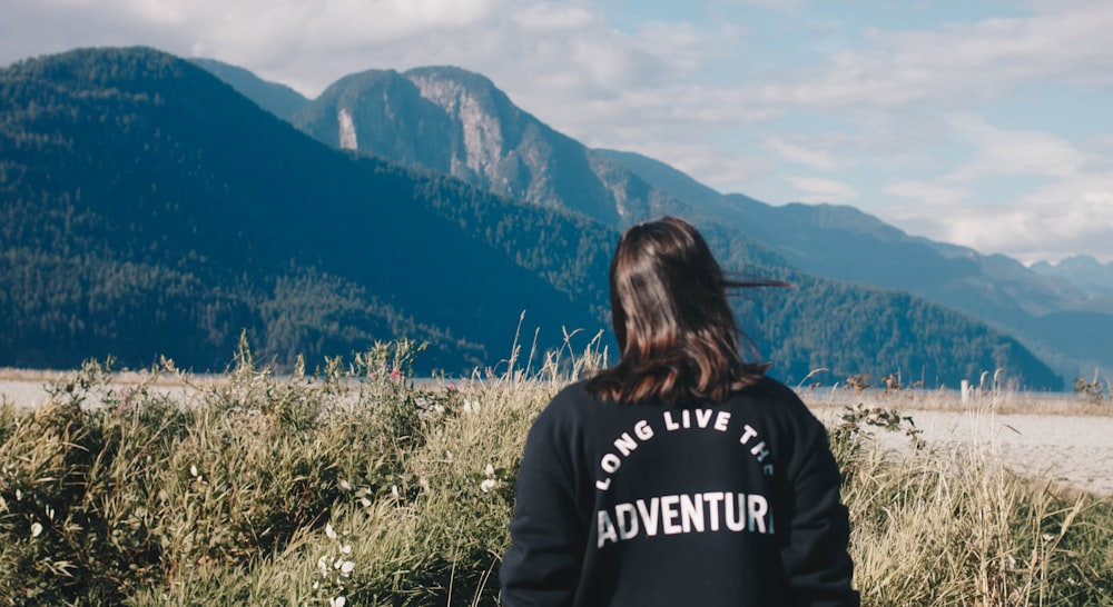 person looking at the mountain during daytime