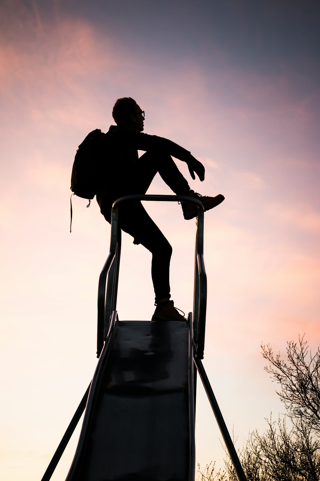 silhouette photography of man with backpack