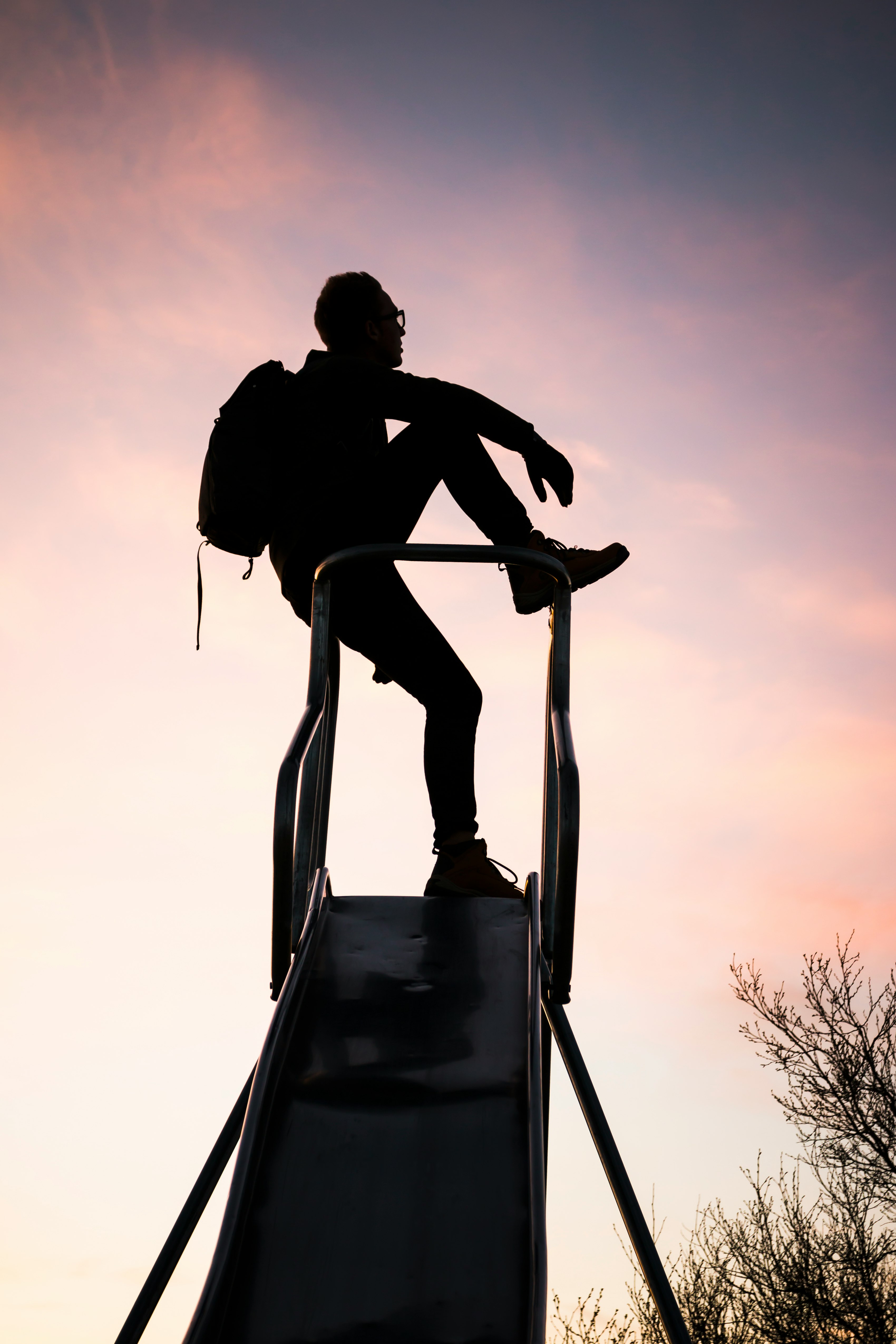 silhouette photography of man with backpack
