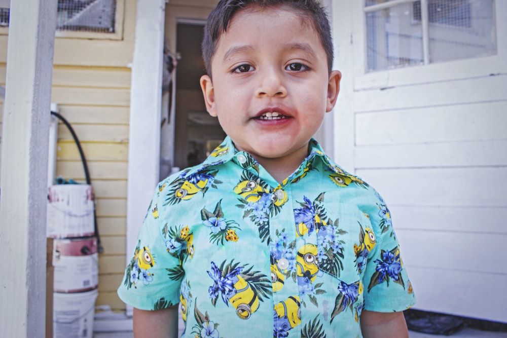 boy wearing multicolored floral button-up shirt