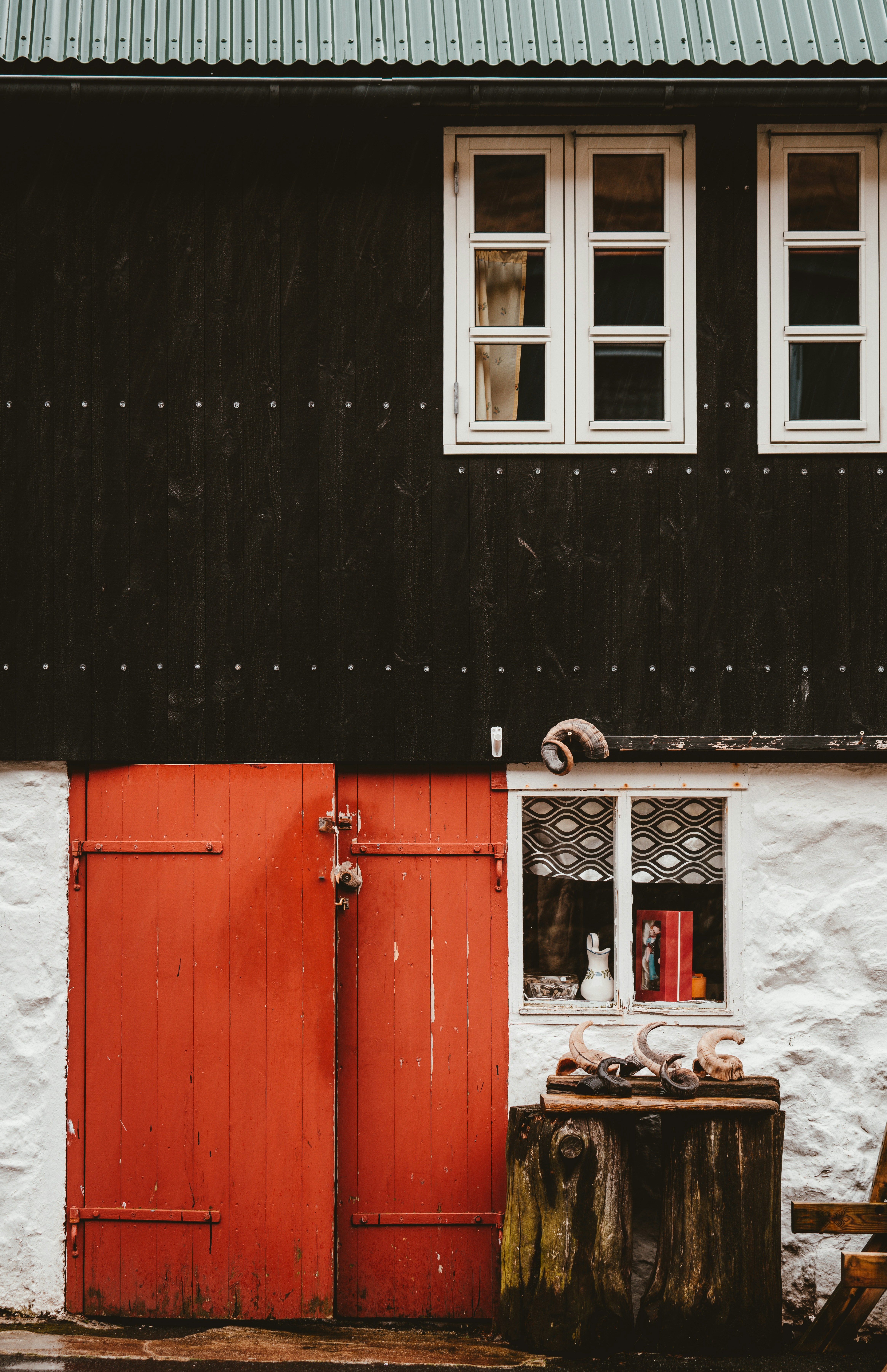 Black And White House With Red Wooden Door Photo Free Air