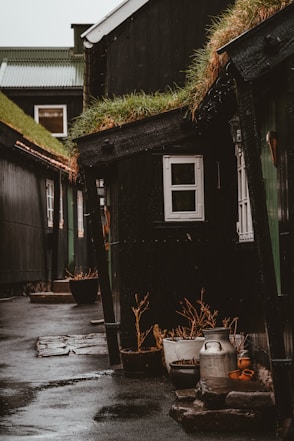 gray milk churn at the door