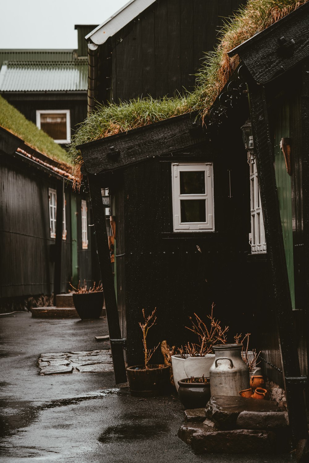 gray milk churn at the door