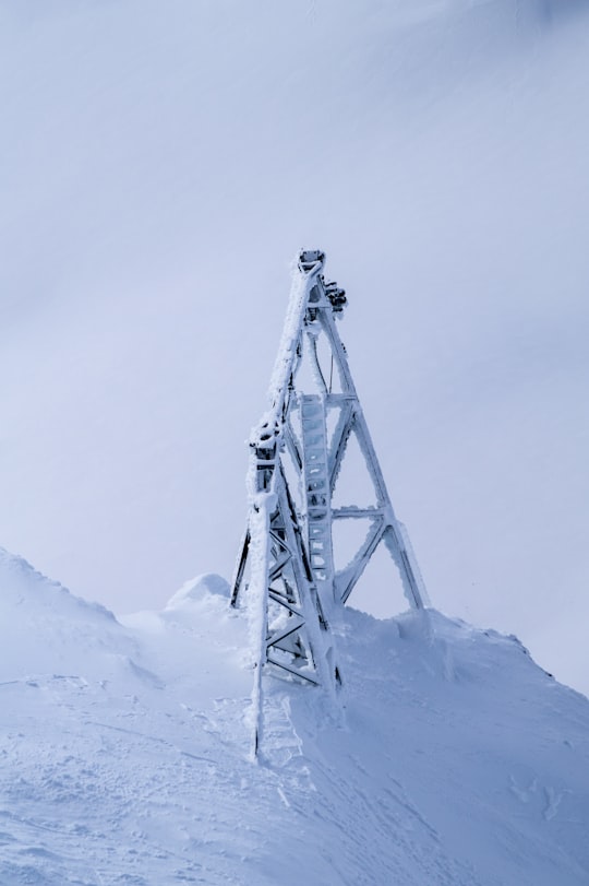 photo of white tower covered with snow in Säntis Switzerland