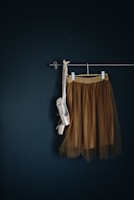brown skirt hanged on wall