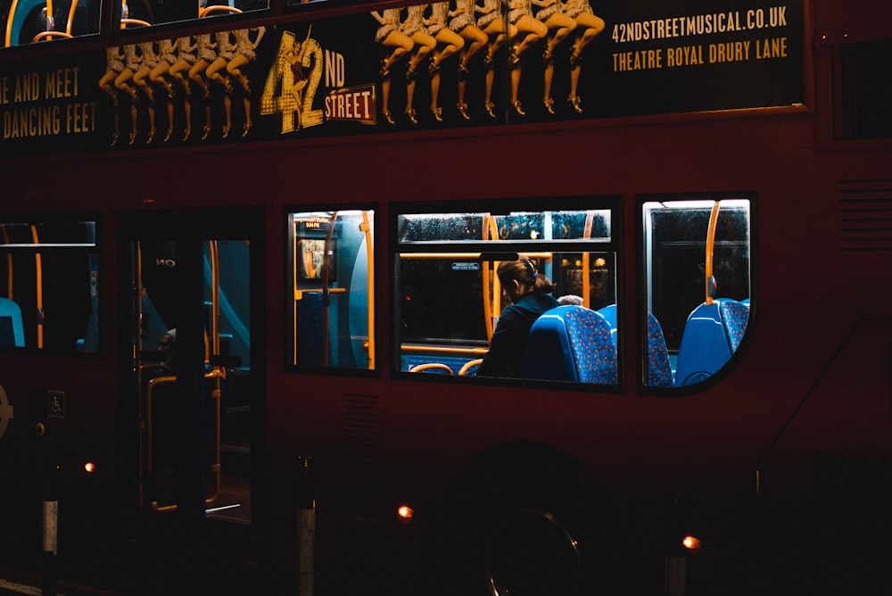 person riding inside double deck bus