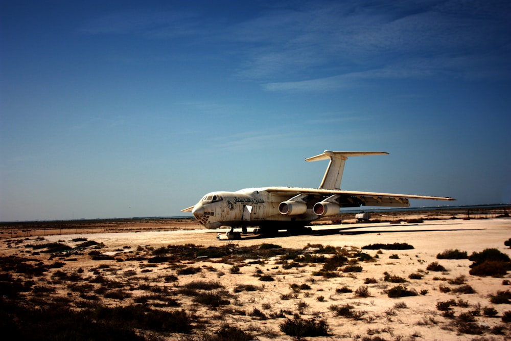 white airliner under blue sky during daytime