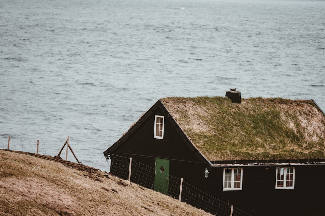 house near body of water, Nordic home at Gjógv