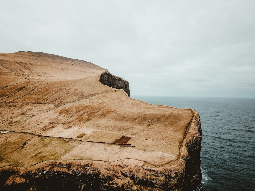 mountain near body of water