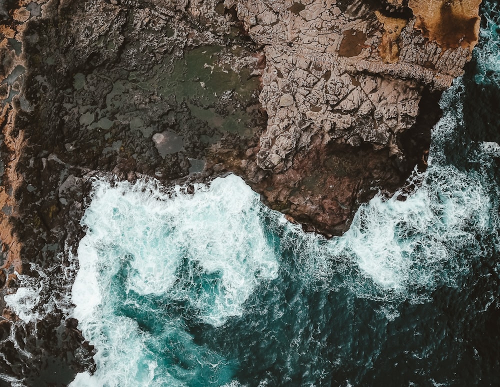 body of water crushing on shore