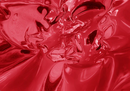 Abstract deep crimson red geometric shape with bright red liquid accents symbolizing energy and movement.