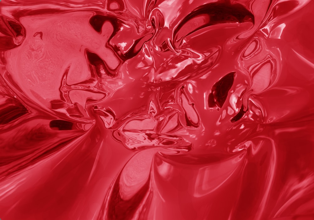 a close up of a red liquid substance