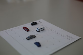 A calendar with marked dates and a car key placed on top, symbolizing flexible driver bookings.