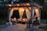 photo of gazebo with curtain and string lights