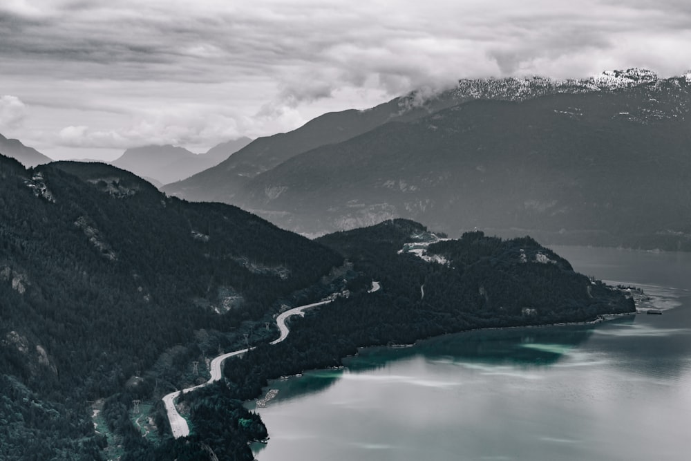 birds eye photography of mountain and body of water