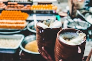 a close up of a person holding a pastry