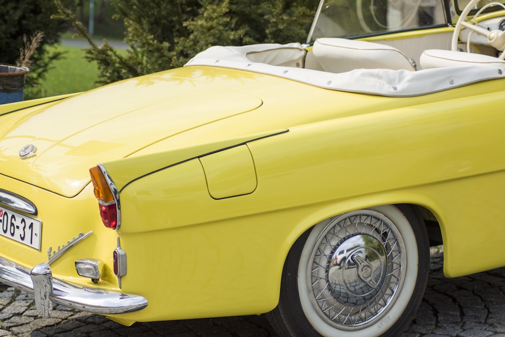 parked yellow convertible