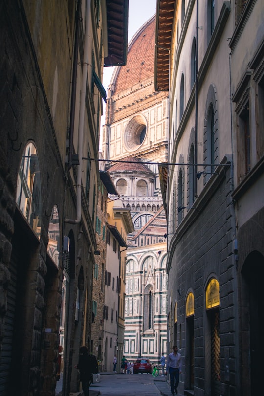 man walking on street in Cathedral of Santa Maria del Fiore Italy