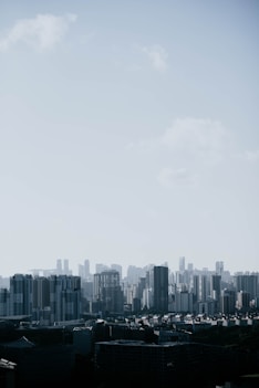 aerial view of buildings under cloudy sky