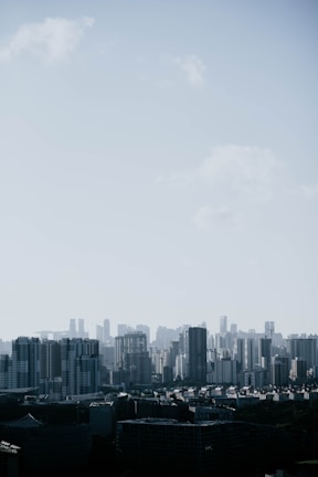 aerial view of buildings under cloudy sky