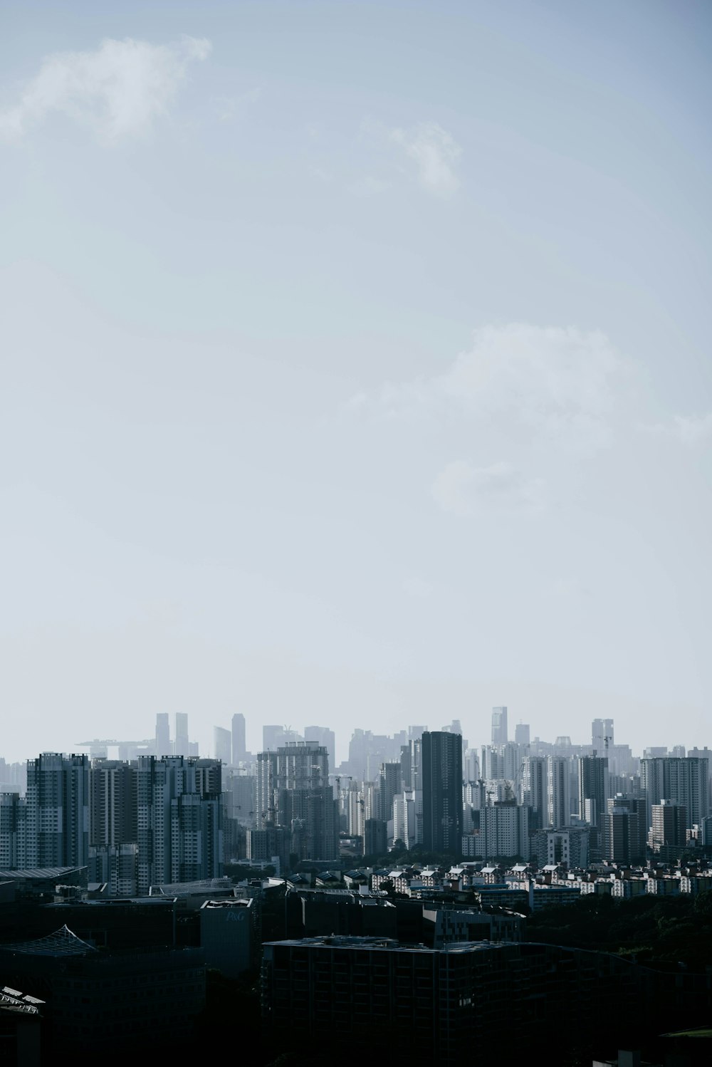 aerial view of buildings under cloudy sky