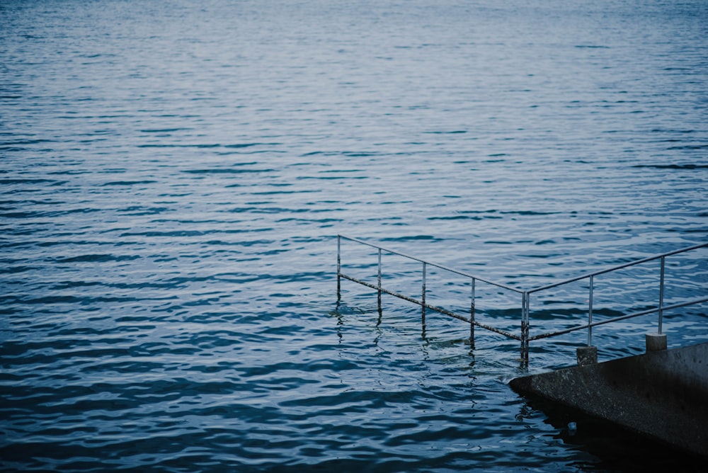 body of water near stairs