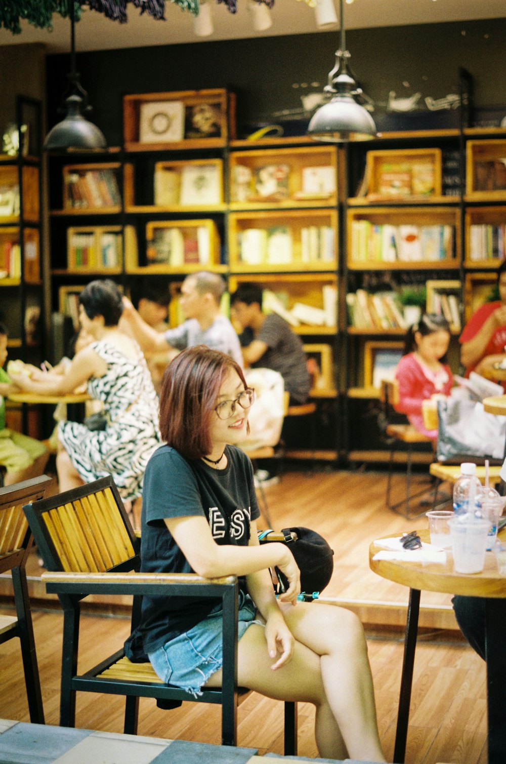 woman sitting on armchair in front of table