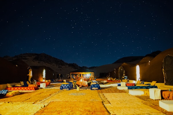 lined up outdoor beds under starry night