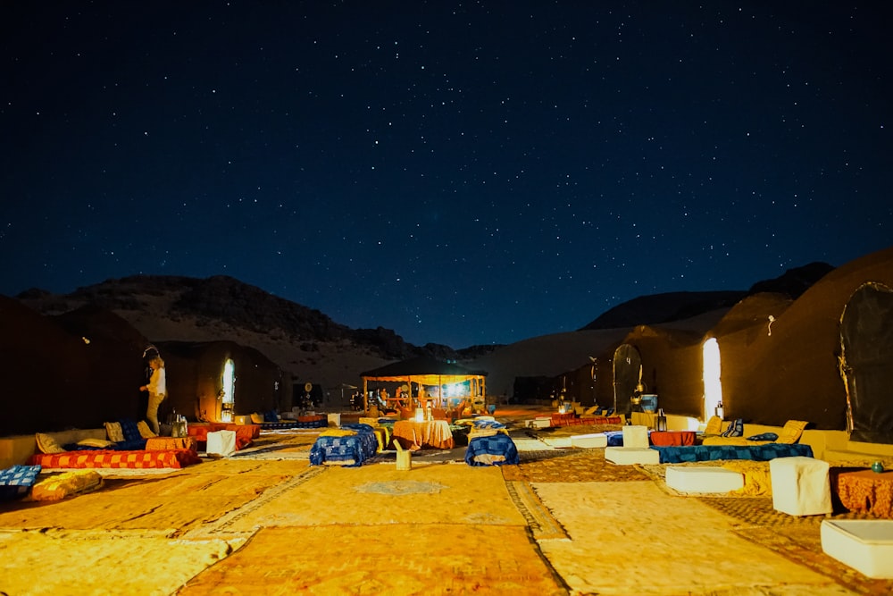 lined up outdoor beds under starry night