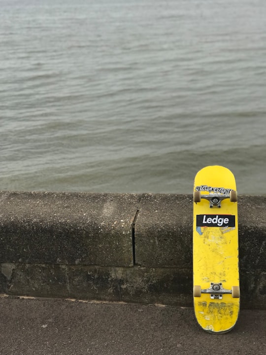 yellow Ledge skateboard near body of water in Southend-on-Sea United Kingdom